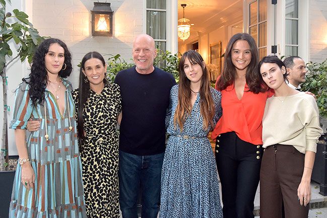 Bruce Willis surrounded by his daughters Scout, Tallulah and Rumer and his wife Emma and his ex wife Demi