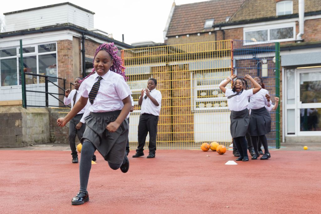 school children playing in school playground