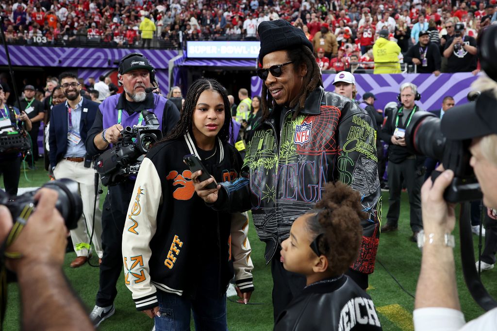 American Rapper Jay-Z stands on the sidelines with daughter Blue Ivy Carter before Super Bowl LVIII between the against the San Francisco 49ers and Kansas City Chiefs at Allegiant Stadium on February 11, 2024 in Las Vegas, Nevada.
