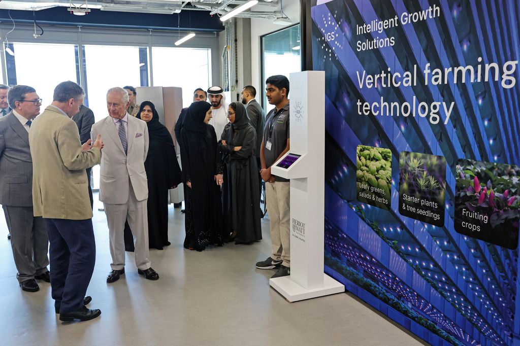 King Charles III watches a demonstration about vertical farming technology during a visit at the Heriot-Watt University 