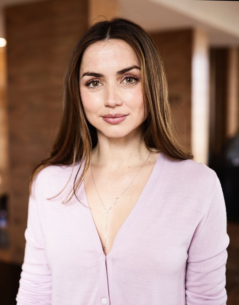  Ana de Armas shoulders up in lilac cardigan