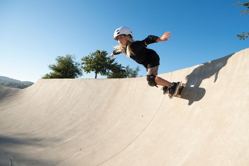 A young girl skateboarding