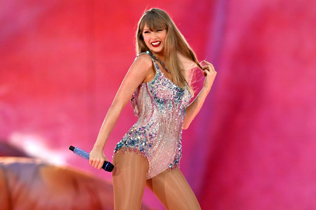 Taylor Swift in glitzy bodysuit on stage