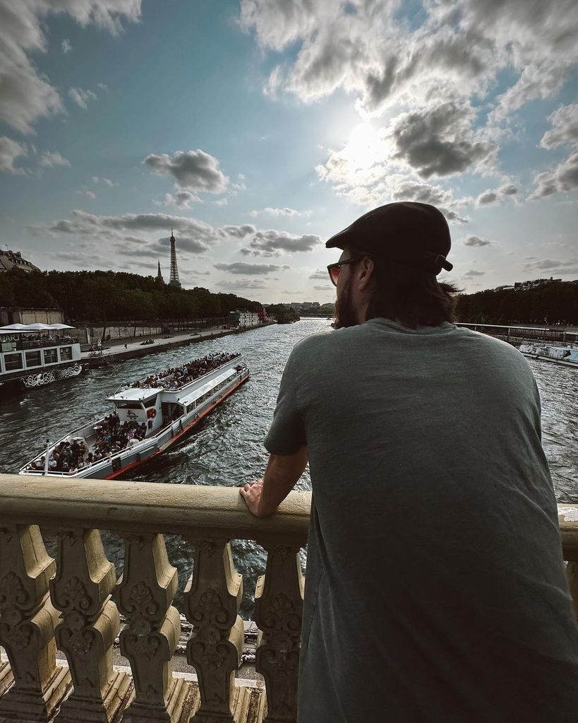 Danny posing on a bridge in Paris 