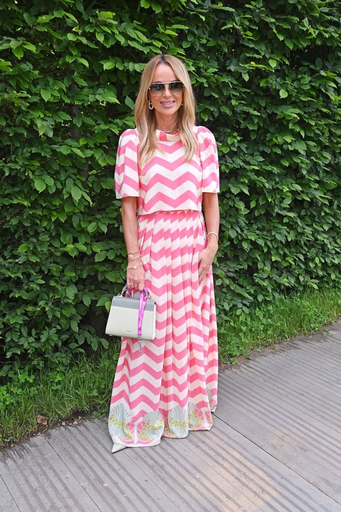 Amanda Holden wears a bold pink and white chevron print dress with puff sleeves and a printed hem at the Chelsea Flower Show 2025.