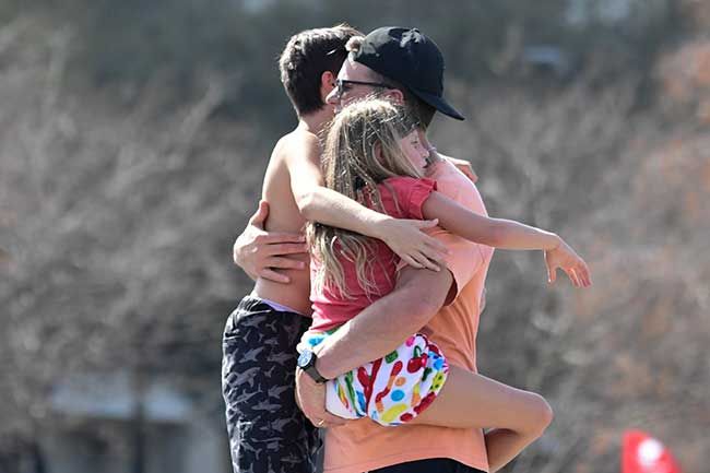 tom brady hugging children