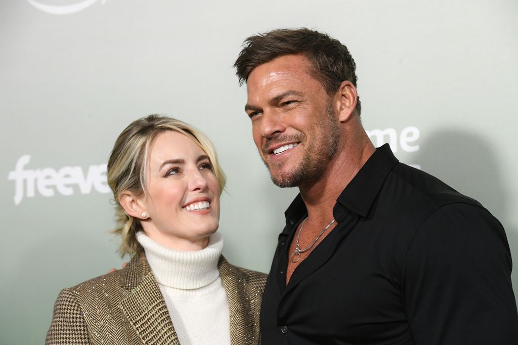Catherine looks up adoringly at her husband Alan Ritchson