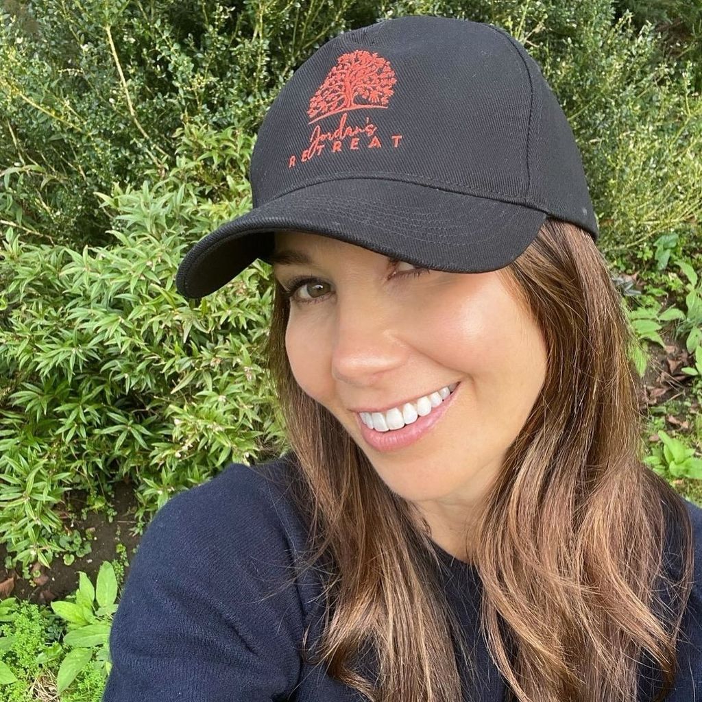 Rosie Green wearing baseball cap on a walk