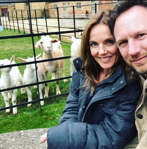 geri and christian take selfie in front of lambs on their farm