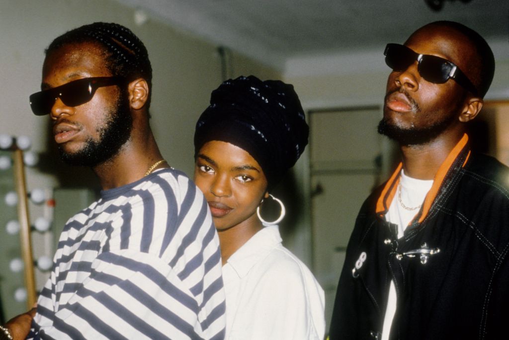  NEW YORK - 1993:  Hip hop group the Fugees (L-R Wyclef Jean, Lauryn Hill and Pras Michel) pose for a portrait backstage at the Manhattan Center in 1993 in New York City, New York.  (Photo By Al Pereira/Michael Ochs Archives/Getty Images)