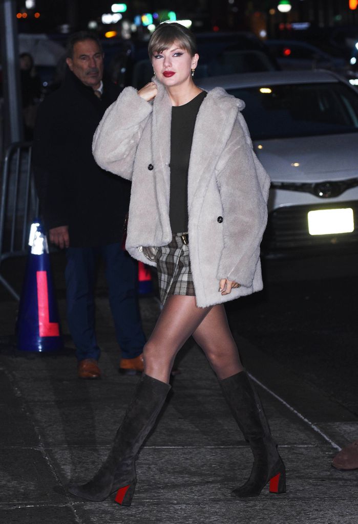 Taylor Swift in tartan mini skirt and beige teddy coat