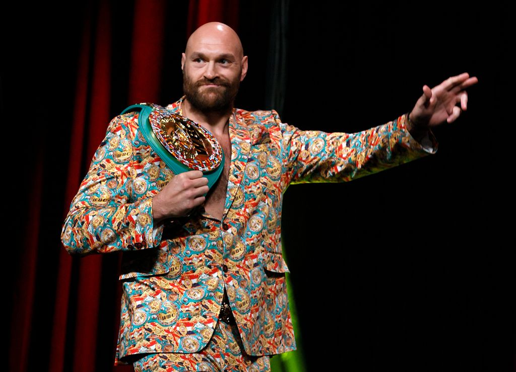 tyson fury in colourful suit on stage 
