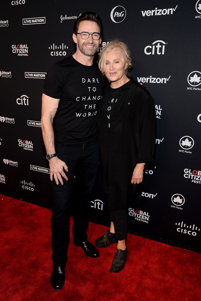 Hugh Jackman and Deborra-lee Furness in matching black T-shirts with white writing
