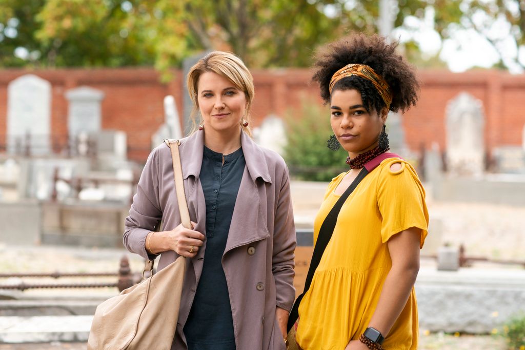 blonde woman and brunette woman in street