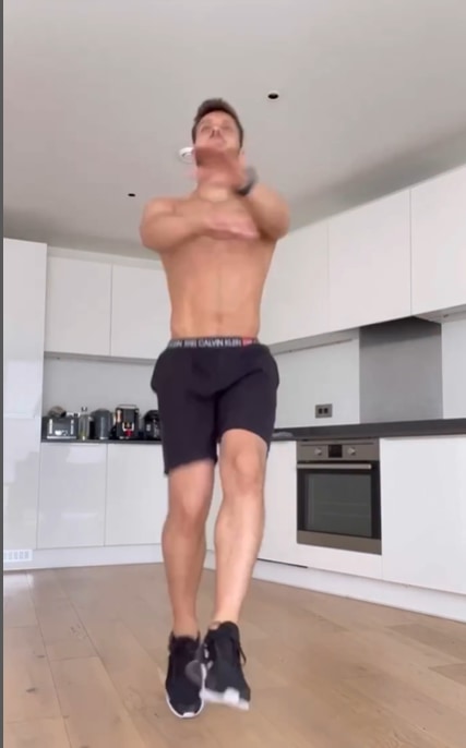 Vito doing workout in white kitchen