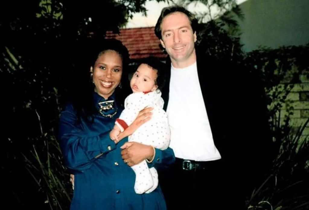 Trisha Goddard holding a baby girl with Mark Grieve