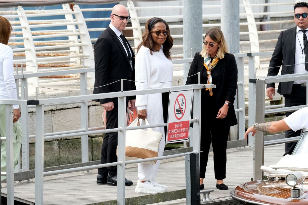 Oprah waits for a water taxi in Venice