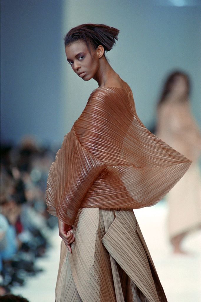 A model displays a 'Pleats Please' creation of Japanese fashion designer Issey Miyake as part of the SS89 ready-to-wear fashion presentation