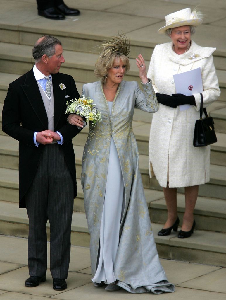 Her Majesty Queen Elizabeth wore a white coat dress to the wedding of Prince Charles and his wife Camilla, Duchess of Cornwall in 2005
