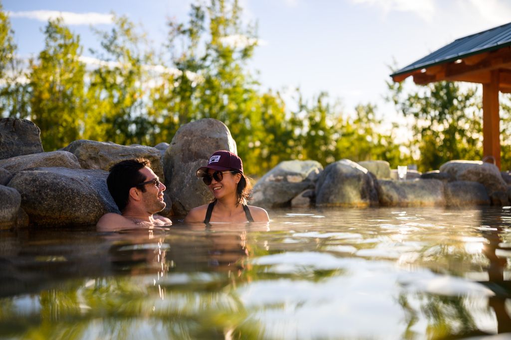 A couple soak in the Japanese onsen-inspired Eclipse Pool at Eclipse Nordic Hot Springs