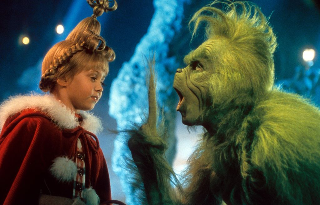 Taylor Momsen listening to Jim Carrey in a scene from the film 'How The Grinch Stole Christmas', 2000.