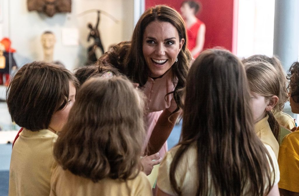 Kate Middleton speaks with children