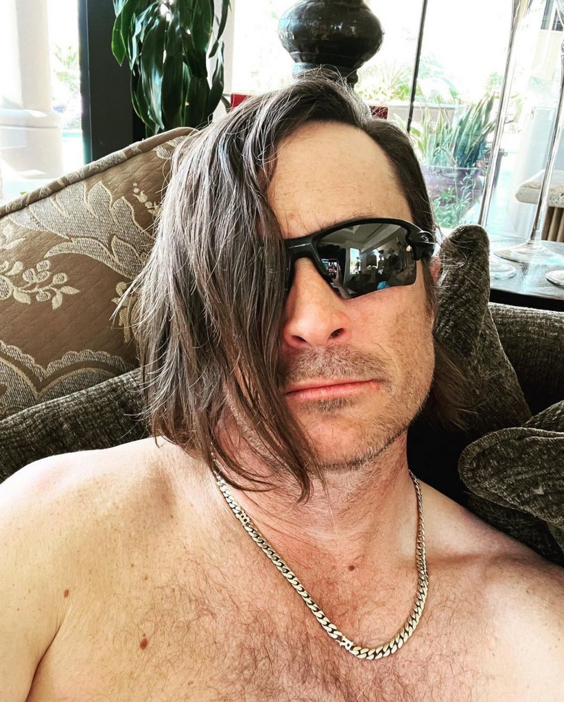 Photo posted by Oliver Hudson on Instagram March 2023 with the caption "I'm not sure who I am anymore..." appearing with unusually long hair and sunglasses.