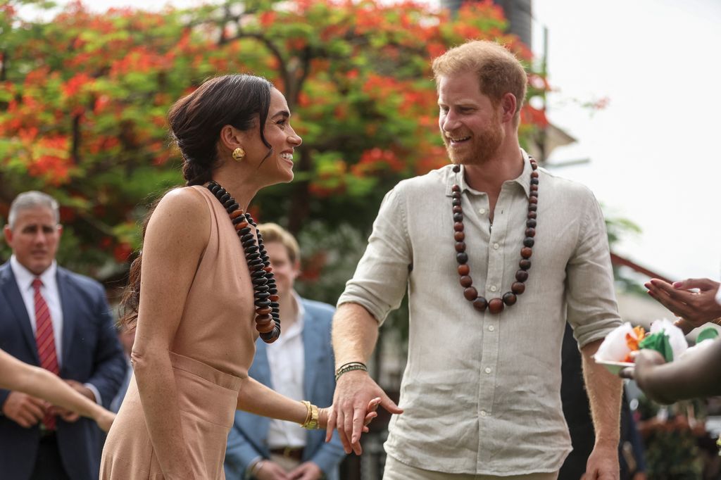 Meghan Markle looking at her husband Prince Harry