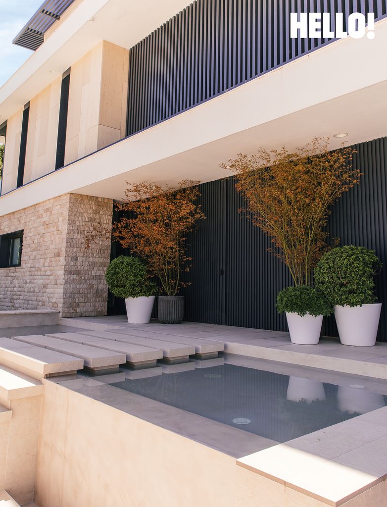 One of the outdoor pools outside their three-storey, contemporary-style house