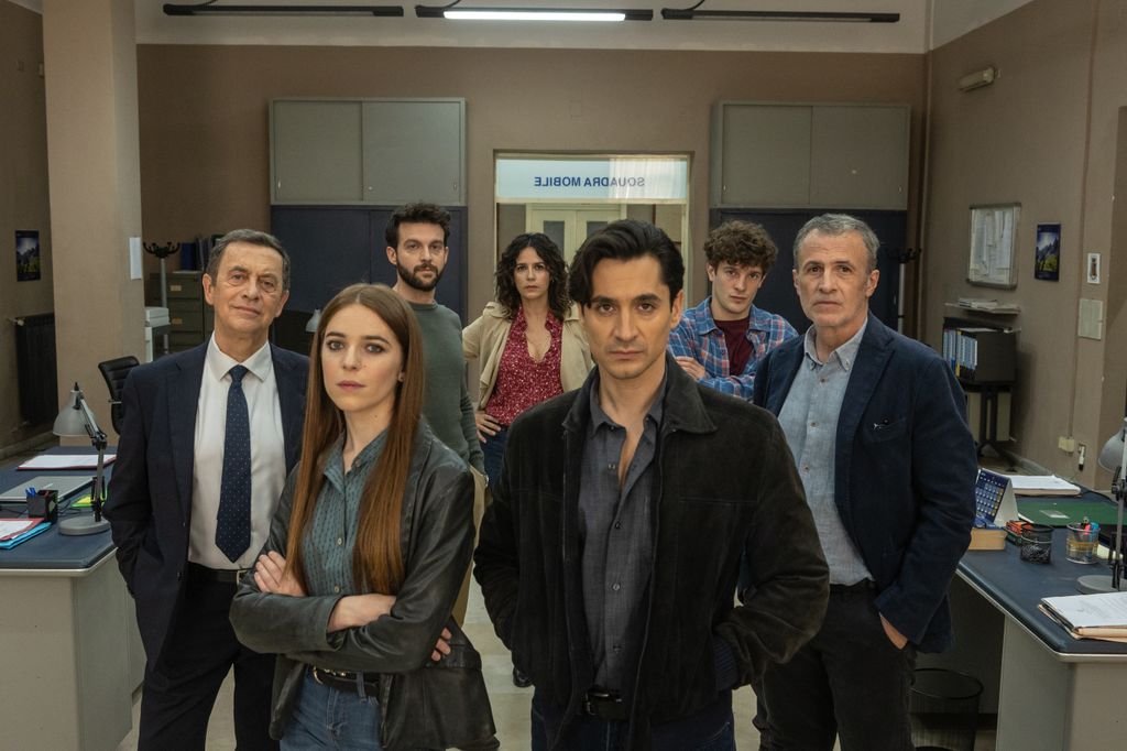 group of police detectives in station