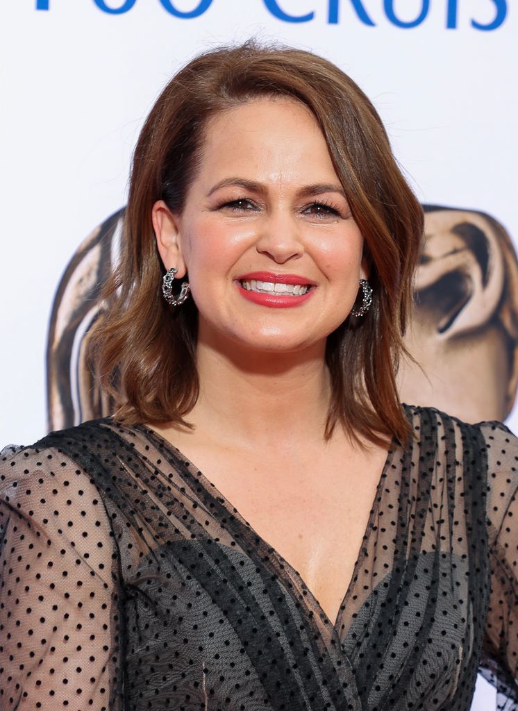 Giovanna Fletcher shoulders up smiling in black dress