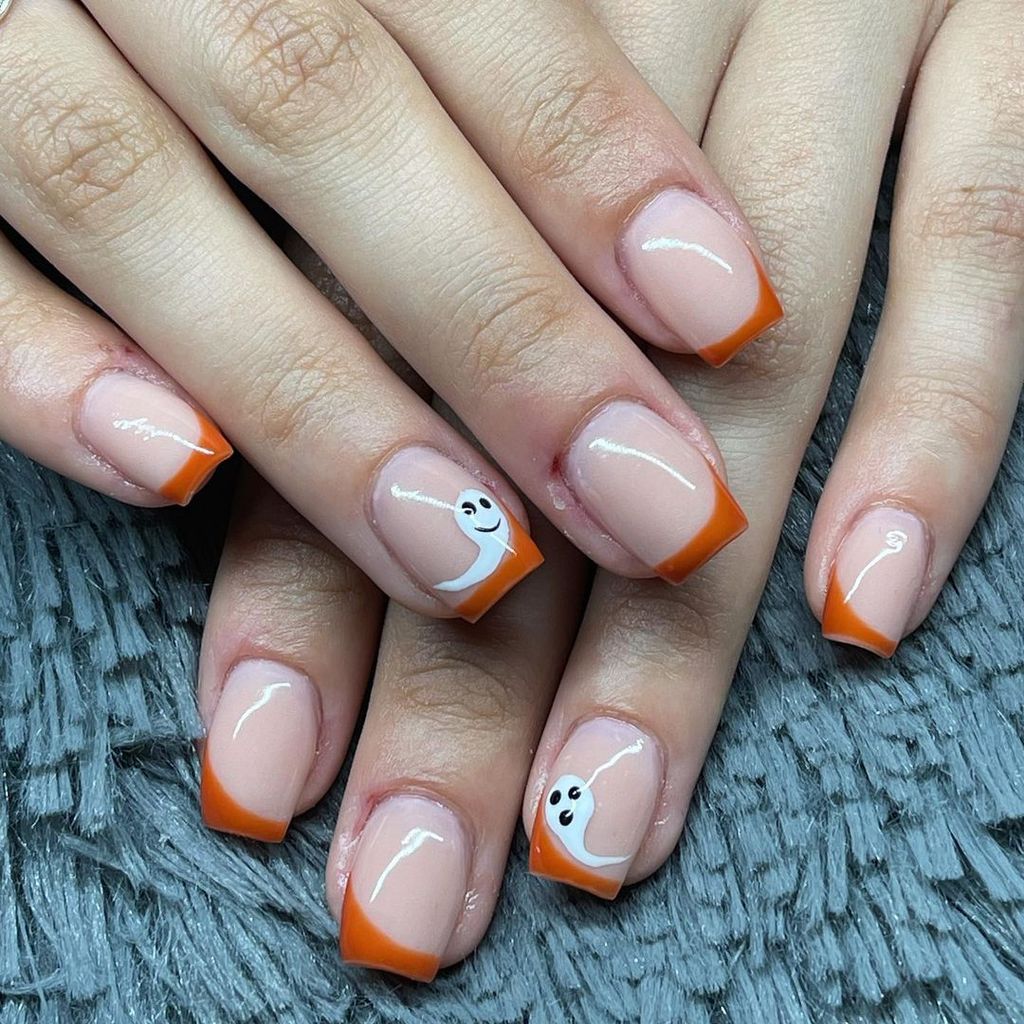 ghost nails with orange french tips