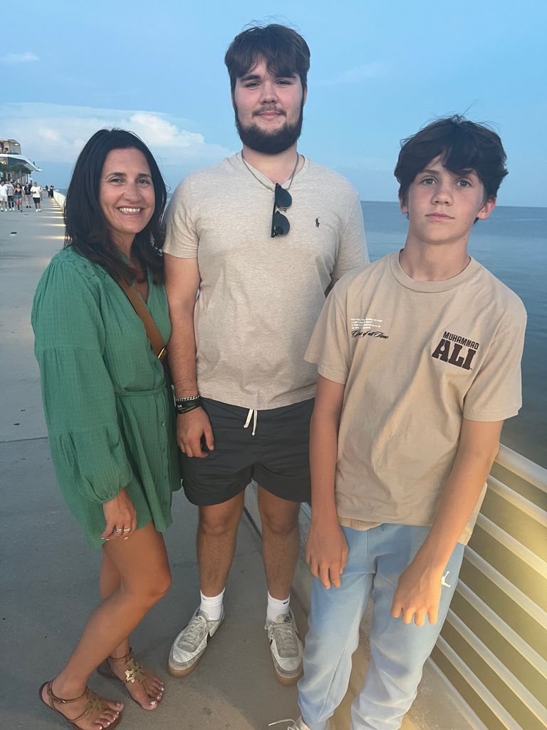 Donna and her 2 sons, Oliver, 19 and Billy, 13 on the St Petersburg pier 