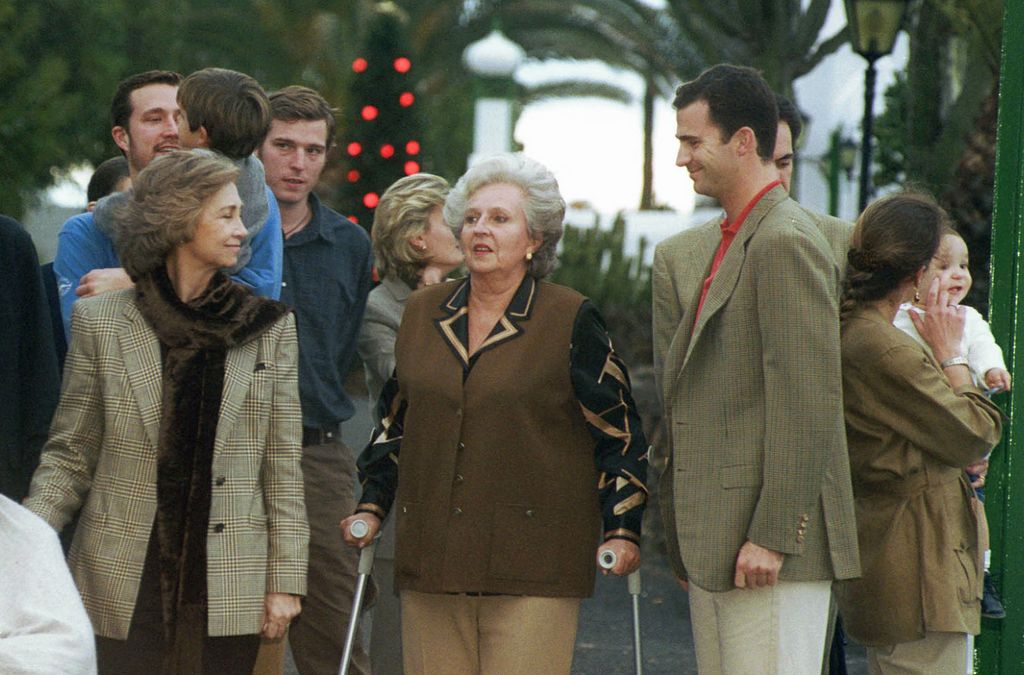 Queen Sofia (left)  walking with Infanta Pilar and King Felipe