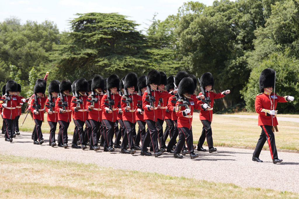 Members of the Scots Guards march up Cambridge Drive