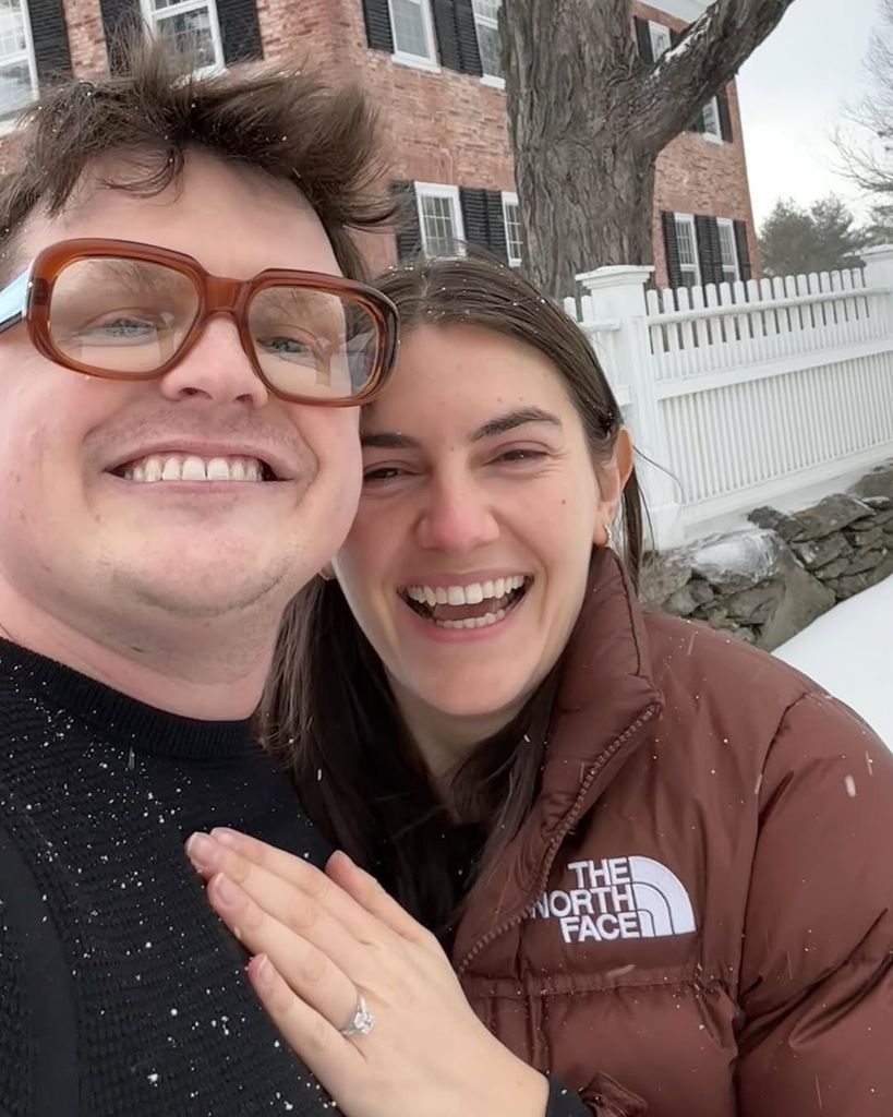 Sam Michael Fox and Molly Milstein pose for a selfie after their engagement, shared on Instagram