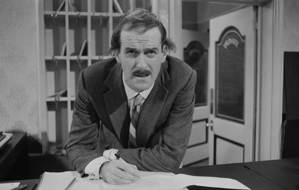 Actor John Cleese in a scene from episode 'A Touch of Class' of the BBC television sitcom 'Fawlty Towers', December 23rd 1974. (Photo by Don Smith/Radio Times via Getty Images)
