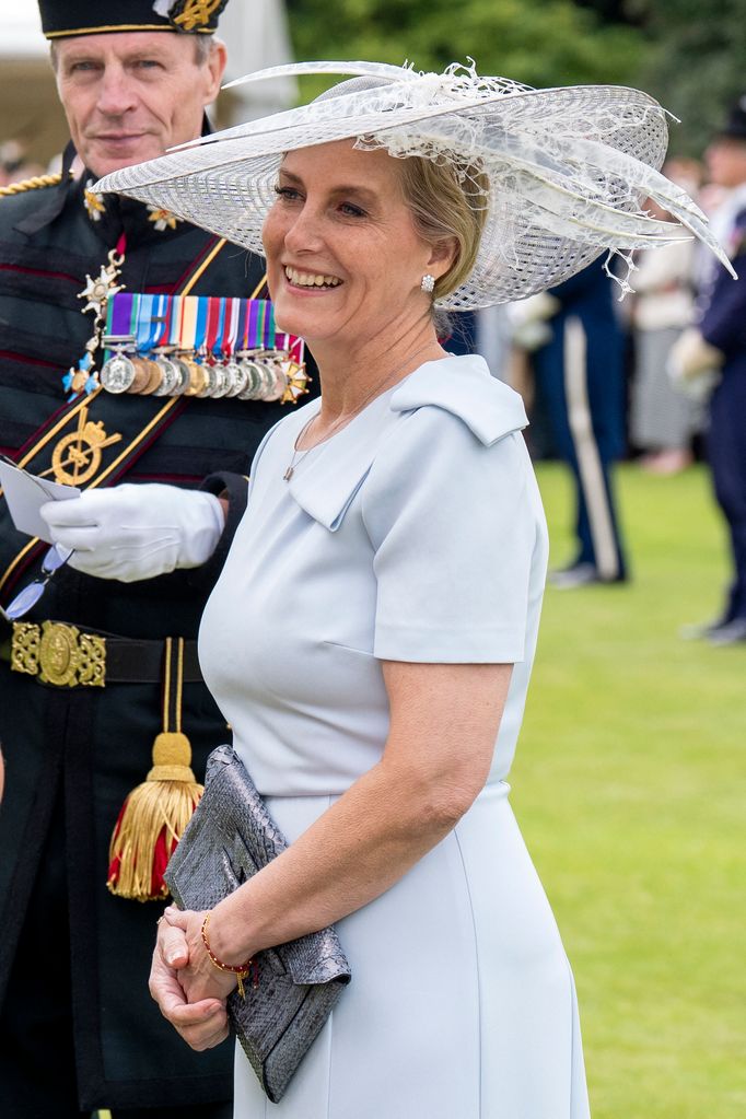 The Duchess of Edinburgh smiling in blue dress and hat
