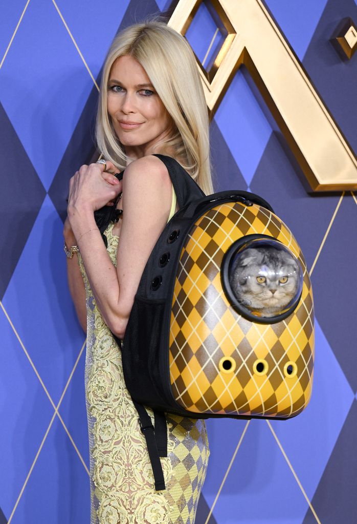 Claudia Schiffer with Chip the cat in a backpack