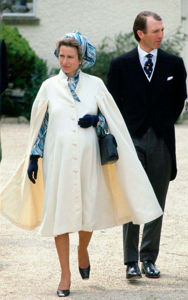 Princess Anne in a white coat and blue dress