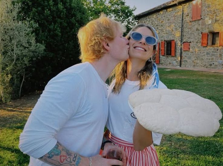 Ed Sheeran kissing Cherry Seaborn on the cheek