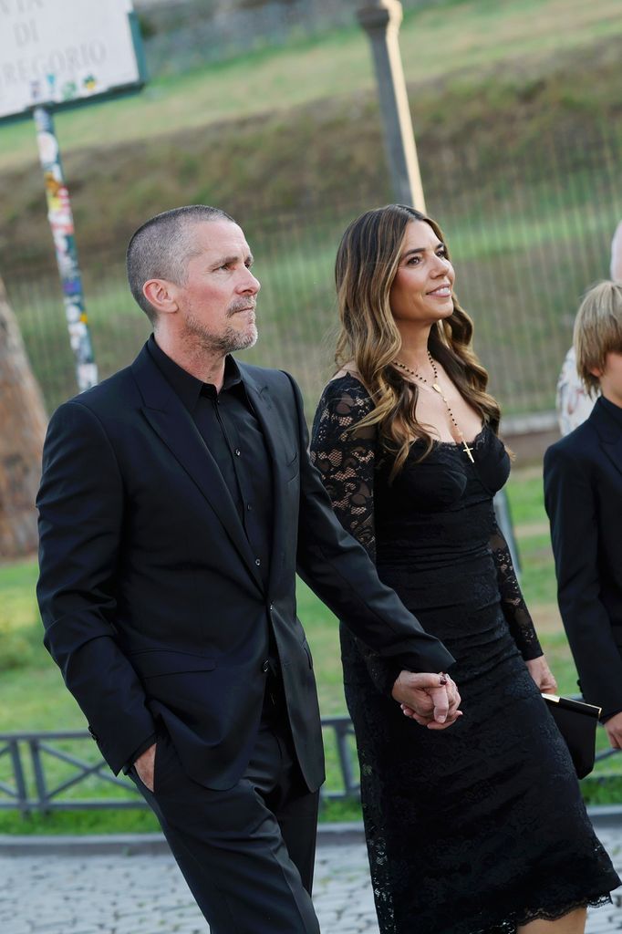 Christian Bale and Sibi Blazic are seen outside the Dolce & Gabbana Alta Moda fashion show at Foro Romano in Rome