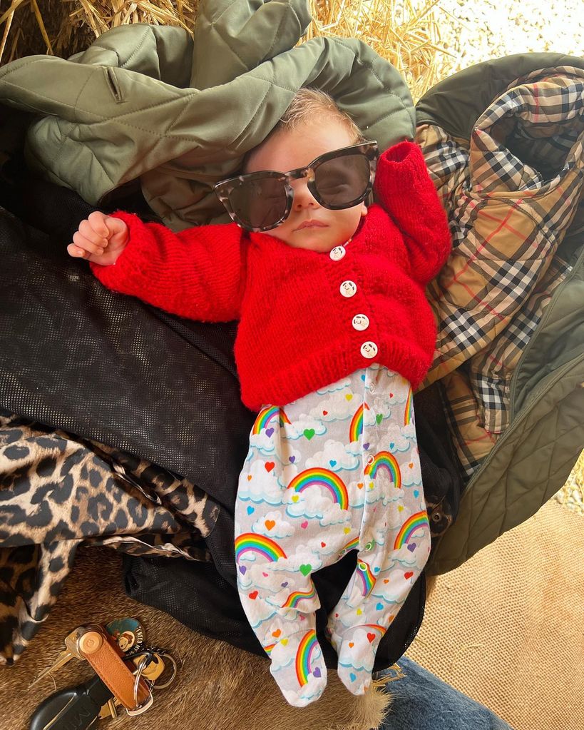 A photo of newborn baby Frankie wearing a pair of oversized sunglasses