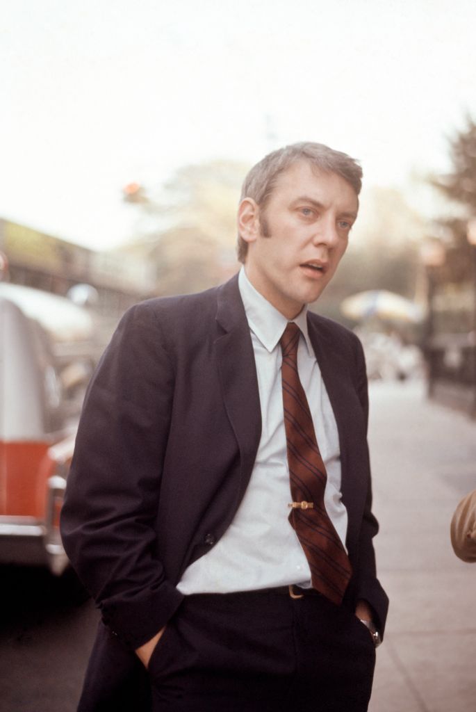 Actor Donald Sutherland stands outdoors with his hands in his pockets, New York City, 1960.
