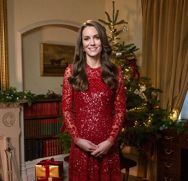kate middleton wearing red needle and thread dress and posing in front of christmas tree
