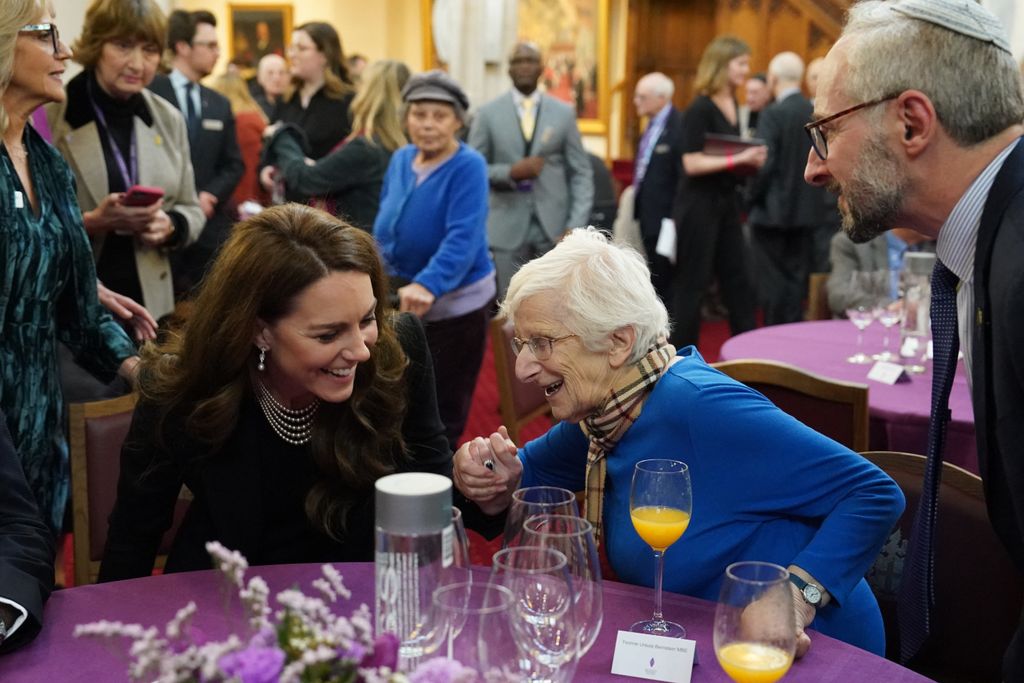 Kate Middleton holding hands with Holocaust survivor