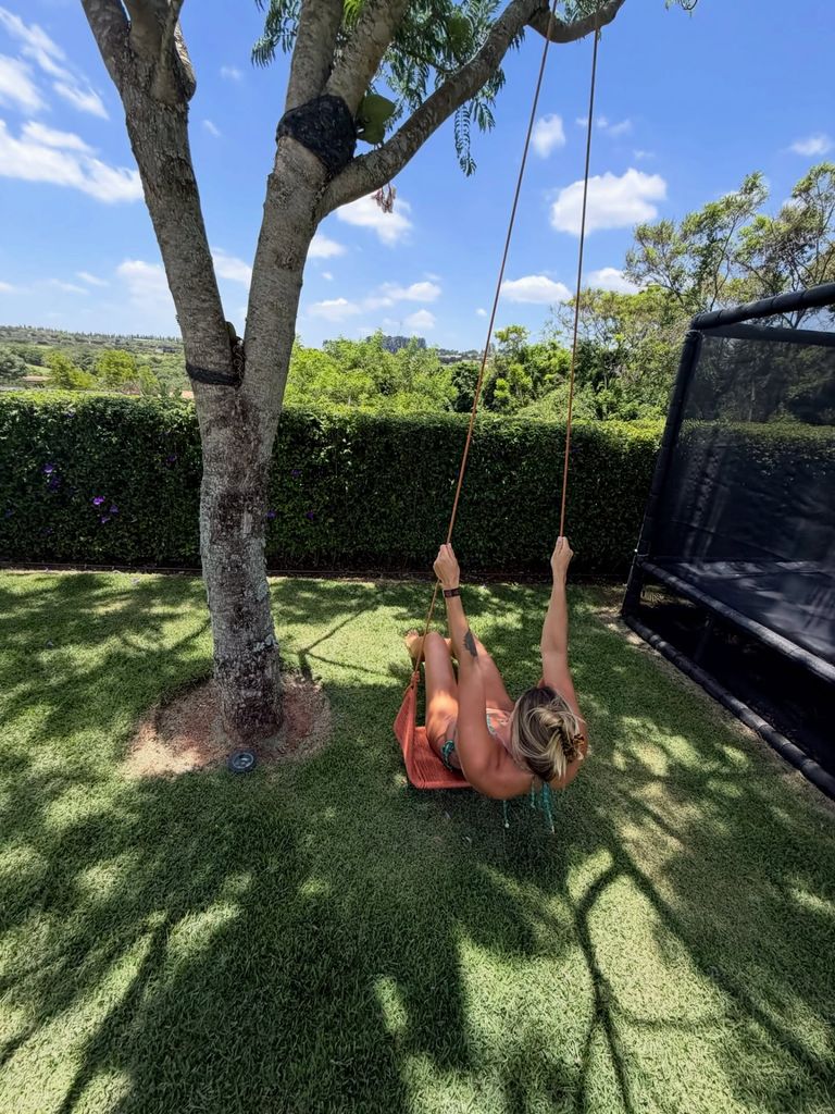 photo of aryna sabalenka in a bikini on a swing