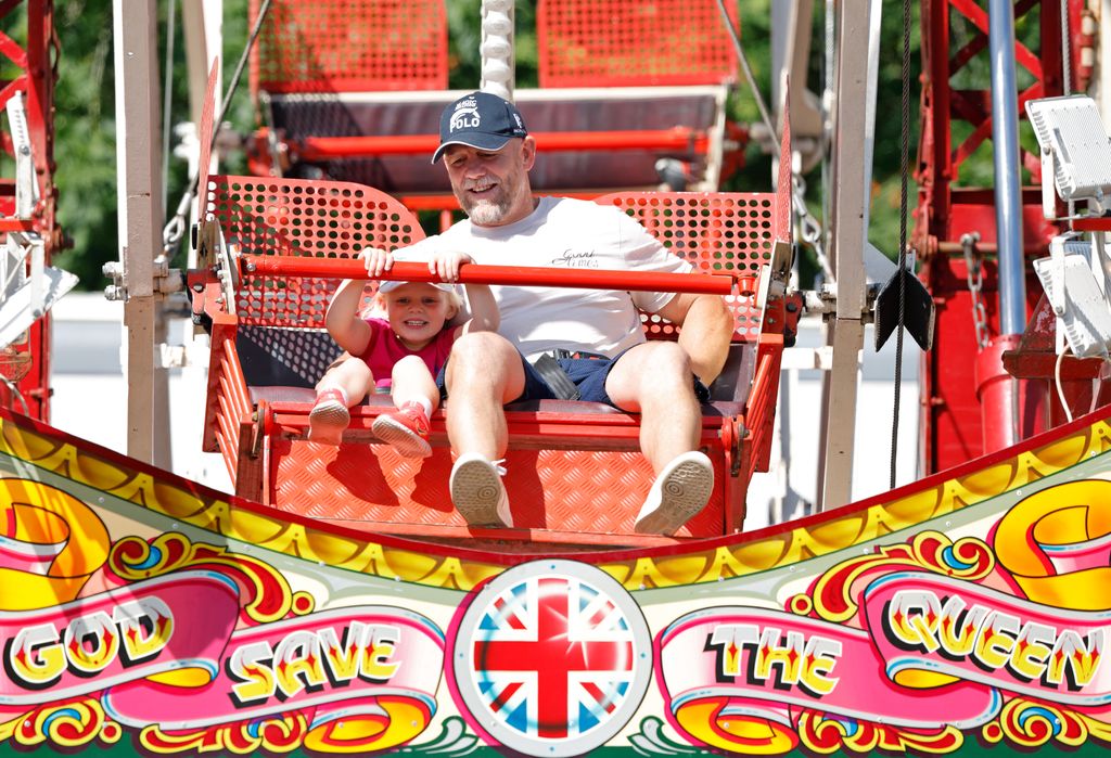 Lena Tindall and Mike Tindall ride on a Ferris wheel 