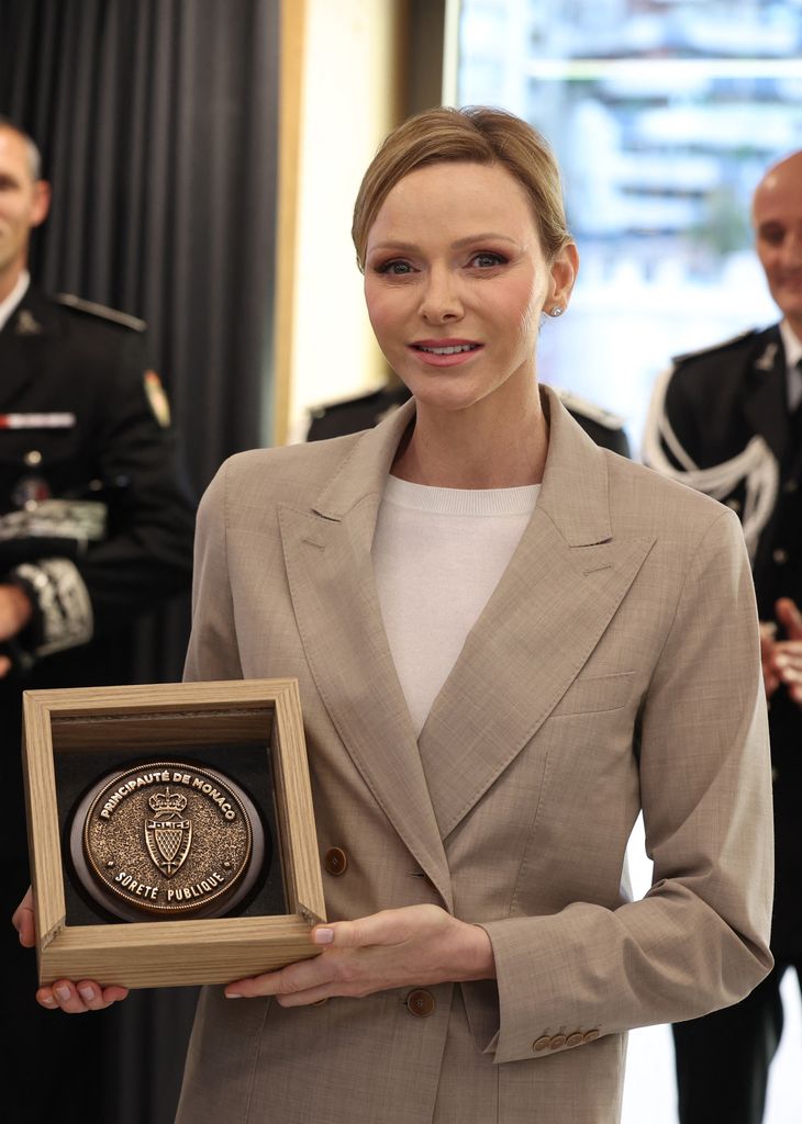 Princess Charlene of Monaco poses during the presentation ot the canine brigade in The Principality of Monaco on October 27, 2025. The princess is the initiator of the creation of the canine brigade and she is president of SPA Monaco (Societe Protectrice des animaux) (Photo by Valery HACHE / AFP) / / NO TABLOIDS WEB & PRINT, NO DAILY MAIL, NO DAILY MAIL GROUP, NO VOICI, NO CLOSER (Photo by VALERY HACHE/AFP via Getty Images)          