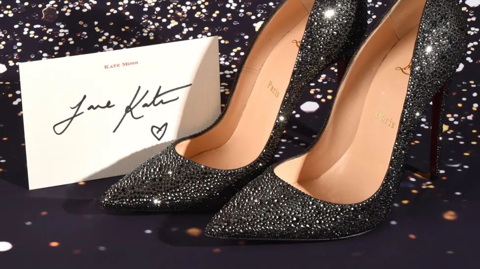 Kate Moss has donated a pair of sparkling Louboutin heels